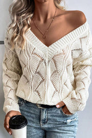 Ivory openwork knit V-neck pullover sweater with a relaxed fit and intricate diamond pattern.