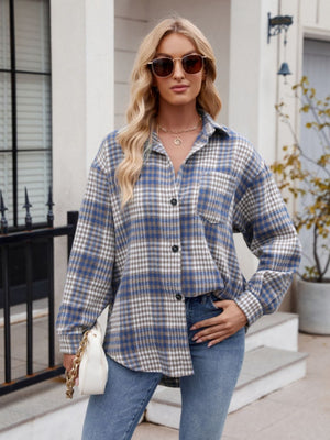 Oversized blue and white plaid shirt jacket with pocket and button front.