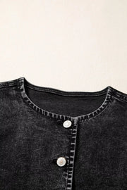 Black denim vest with button front and round neckline.