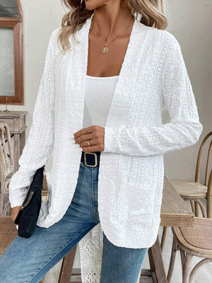 White open-weave embroidered cardigan with pockets and long sleeves.