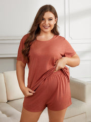 Relaxed fit rust jersey lounge set with crew neck tee and elastic waist shorts.