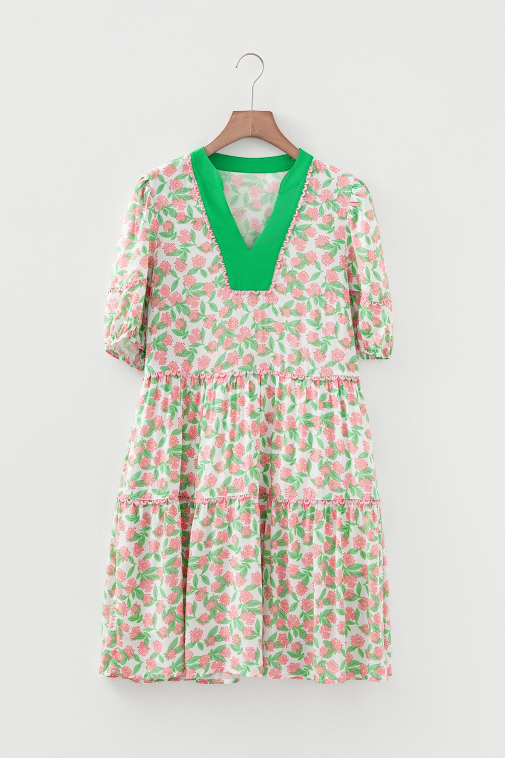 Tiered mini dress with green V-neck and pink floral print