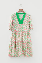 Tiered mini dress with green V-neck and pink floral print
