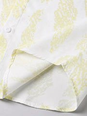 Cotton button-up shirt in Neon Yellow abstract pattern, showing hem detail.
