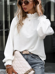 White textured puff sleeve blouse with smocked neck and cuffs.