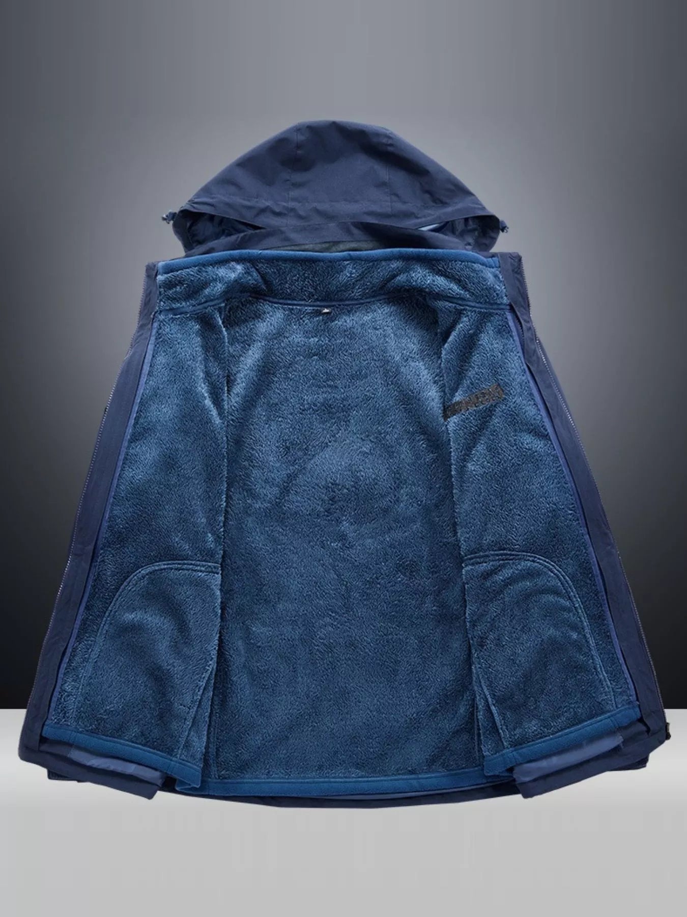 Blue hooded jacket with plush fleece lining and zippered pockets.