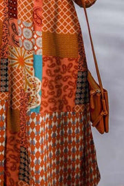 Patchwork print duster shirt jacket in orange with paisley and geometric patterns.