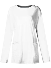 White relaxed fit tunic with long sleeves and two patch pockets.