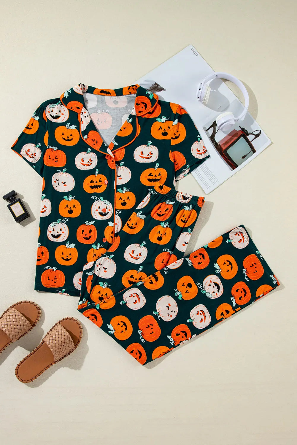Pumpkin Patch Pajama Set with short sleeves and collar, featuring a dark green background with orange and white pumpkin