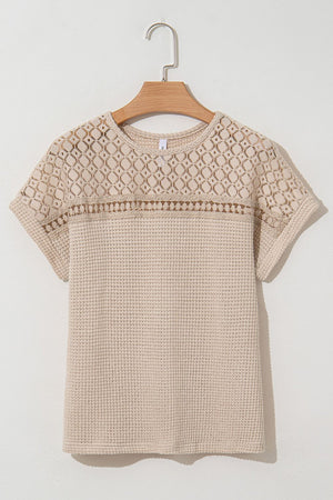 Beige waffle knit top with short sleeves and a lace yoke detail.