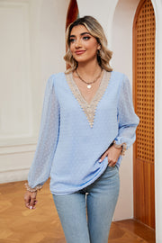 Misty Blue Swiss dot blouse with V-neck lace trim and poet sleeves.
