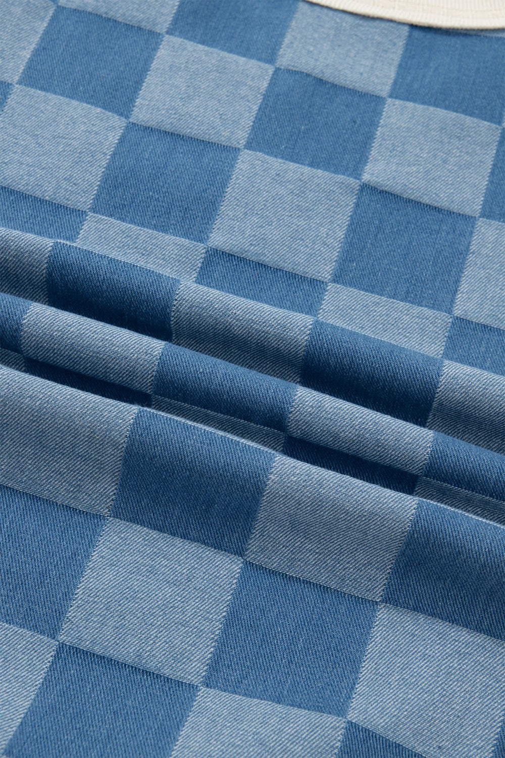 Denim maternity t-shirt with blue checkered pattern, short sleeves, and crew neck.