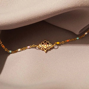 Gold lotus charm bracelet with colorful enamel beads