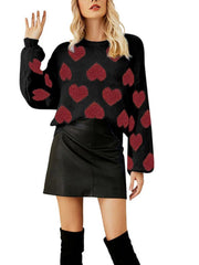 Black acrylic blend sweater with red heart motif and balloon sleeves.