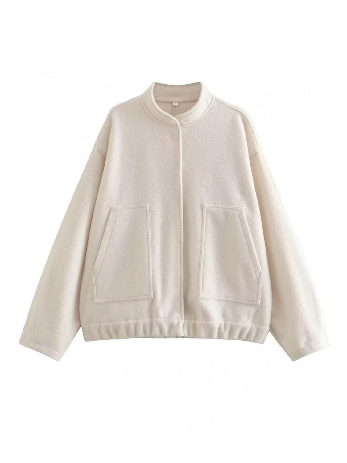 Beige boucle cocoon jacket with snap closure and patch pockets