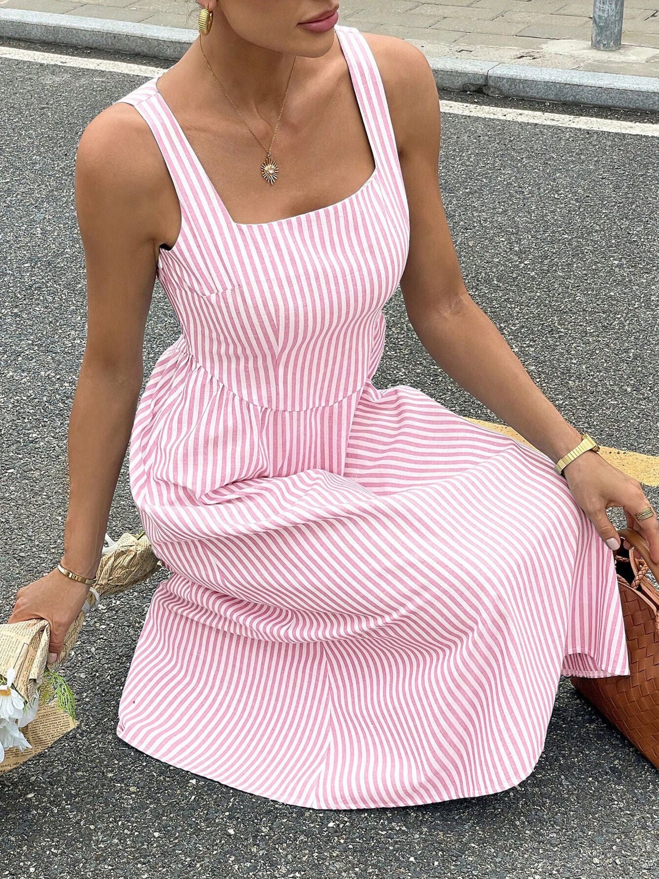 Pink striped midi dress with square neck and a-line cut.