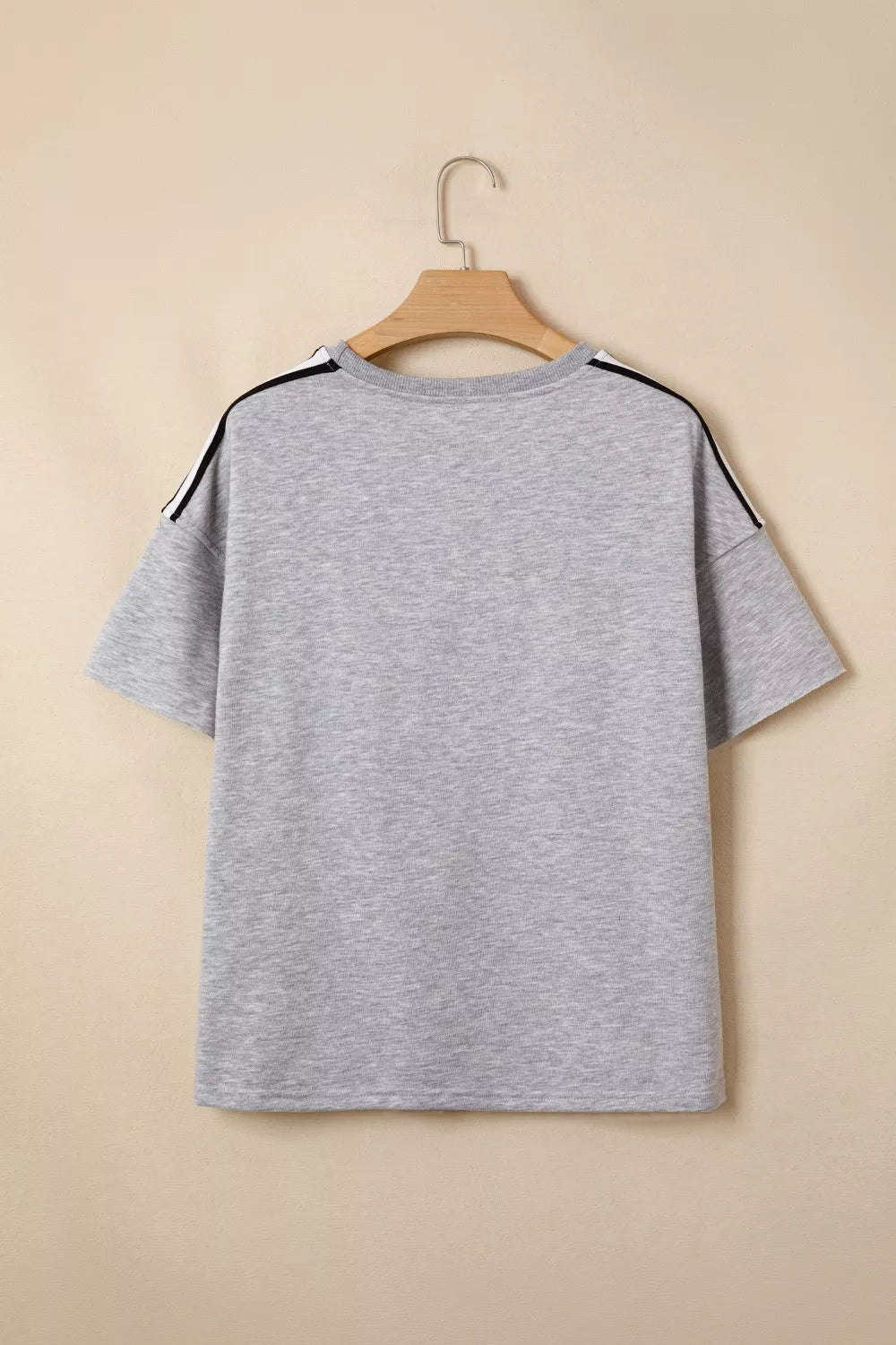 Grey polyester t-shirt with black and white shoulder stripes, relaxed fit, short sleeves.