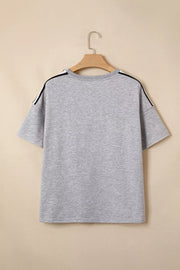 Grey polyester t-shirt with black and white shoulder stripes, relaxed fit, short sleeves.