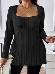 Black ribbed knit tunic with square neckline and long sleeves, styled with a necklace.