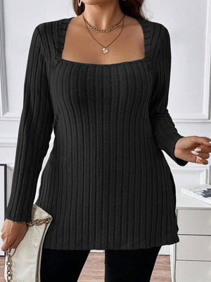 Black ribbed knit tunic with square neckline and long sleeves, styled with a necklace.
