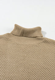 Khaki textured knit turtleneck cap sleeve sweater with waffle knit detail.