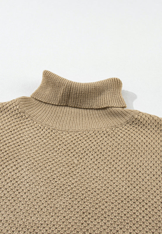 Khaki textured knit turtleneck cap sleeve sweater with waffle knit detail.