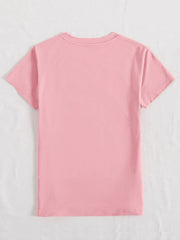 Blush pink t-shirt with iridescent heart and cross appliqué detail on the front.