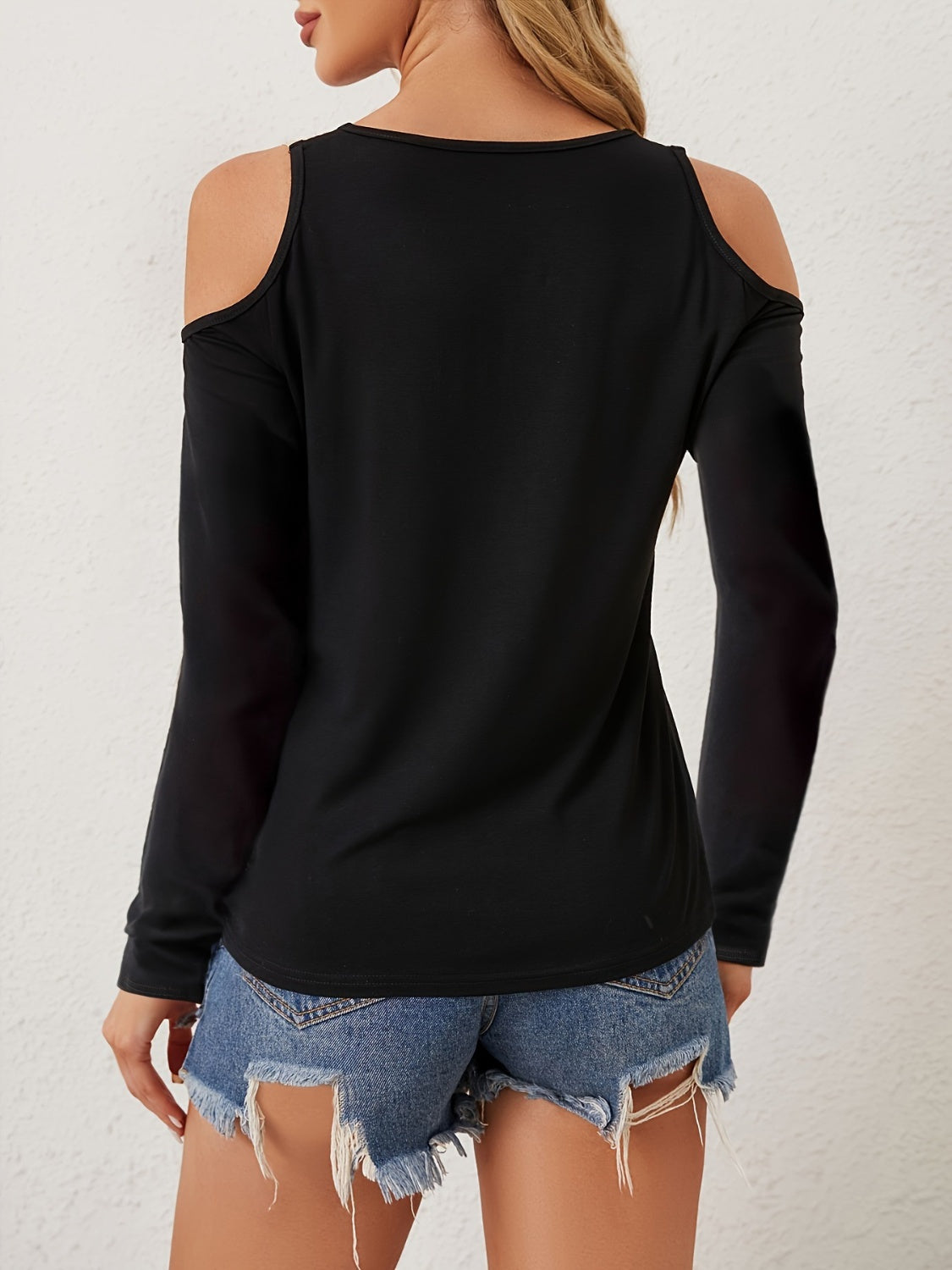 Black cold shoulder knit top with lace inset detail.
