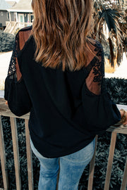 Black sheer yoke embroidered blouse with lace sleeves and tie detail