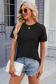 Black ribbed tee with lace raglan sleeves and pintuck detail.