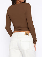 Button-down ribbed crop top in Coffee Brown with long sleeves, shown from the back.