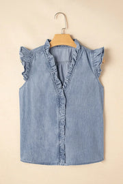 Chambray ruffle trim sleeveless blouse in medium blue cotton with V-neck and button front.