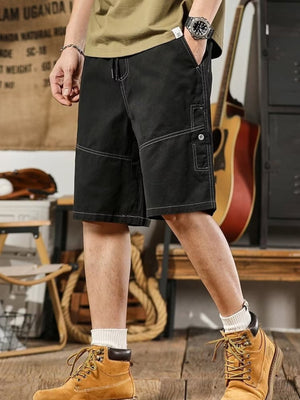 Men's black drawstring shorts with relaxed fit and contrast stitching.