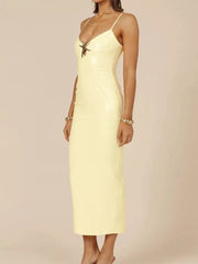 Sequined cami dress in apricot with a star cutout and slit.
