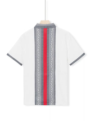White men's short sleeve shirt with bold geometric print and red stripe detail.