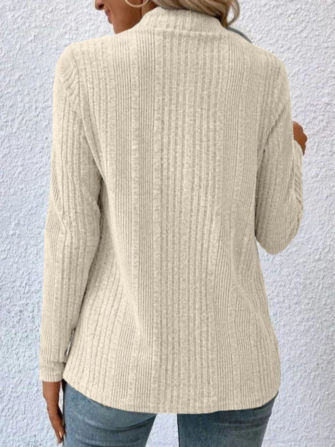 Ribbed ivory waterfall cardigan jacket with a mock neck and long sleeves.