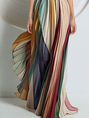 Pleated strapless maxi dress in a colorful striped print with a dramatic silhouette.
