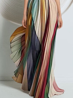 Pleated strapless maxi dress in a colorful striped print with a dramatic silhouette.