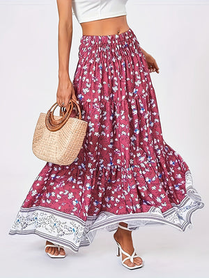 Floral maxi tiered skirt in cerise with a border print, featuring a smocked waist and flowy silhouette.