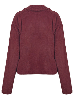Burgundy faux fur biker jacket with a collared neckline and long sleeves.