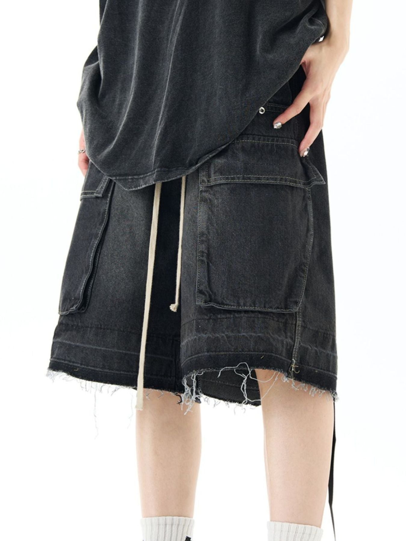 Black denim cargo shorts with drawstring and frayed hem