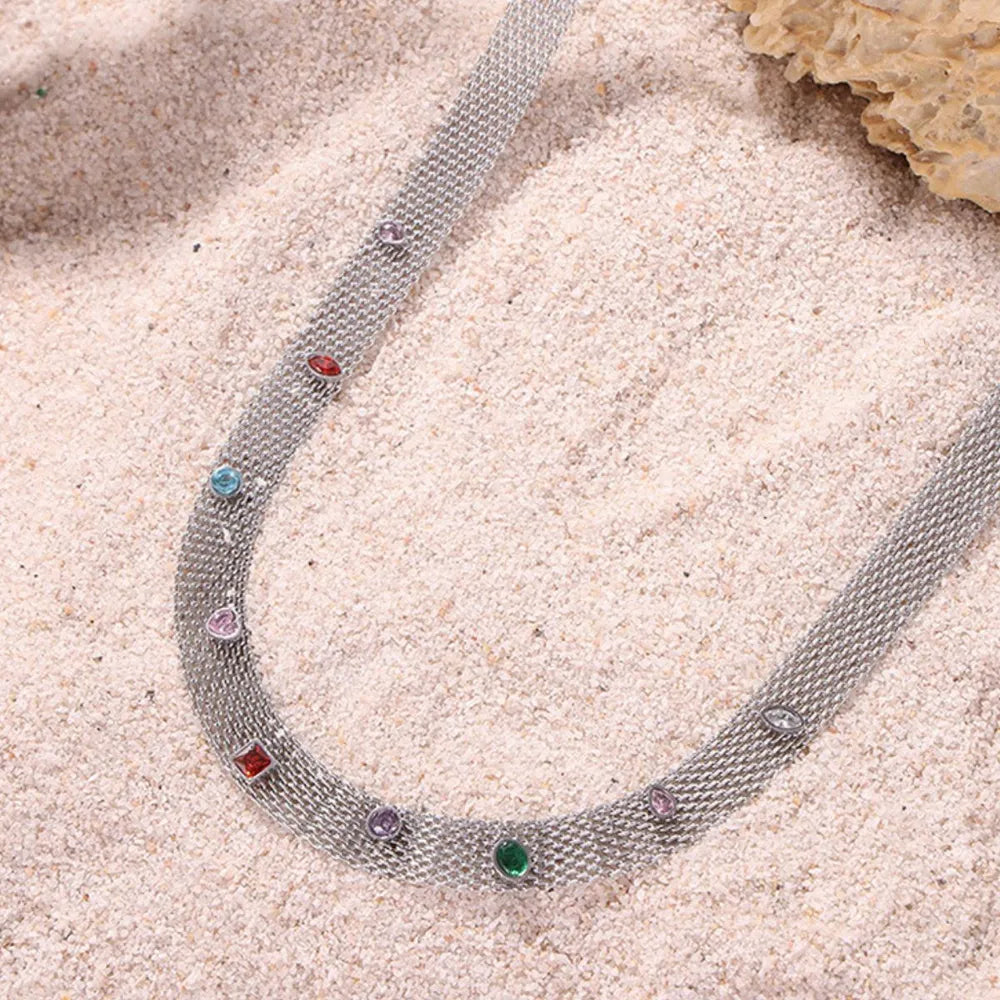 Silver mesh collar necklace with colorful gemstone embellishments