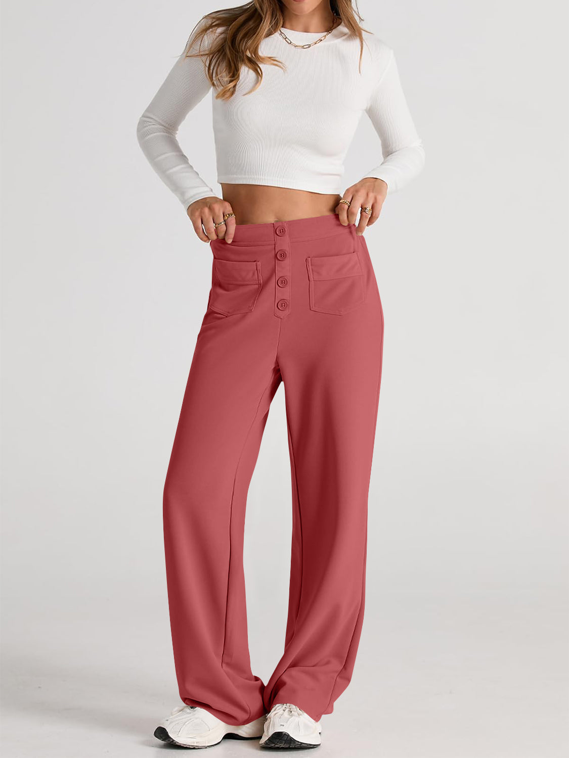 Button-front wide leg trousers in Orange-Red with four button closure and two flap pockets.
