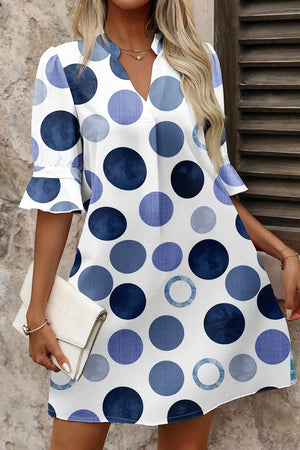 Chic blue polka dot mini dress with flounce sleeves and V-neck.