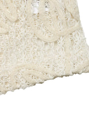 Delicate floral lace tie-front shirt in apricot with cutout details.