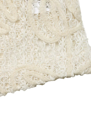 Delicate floral lace tie-front shirt in apricot with cutout details.