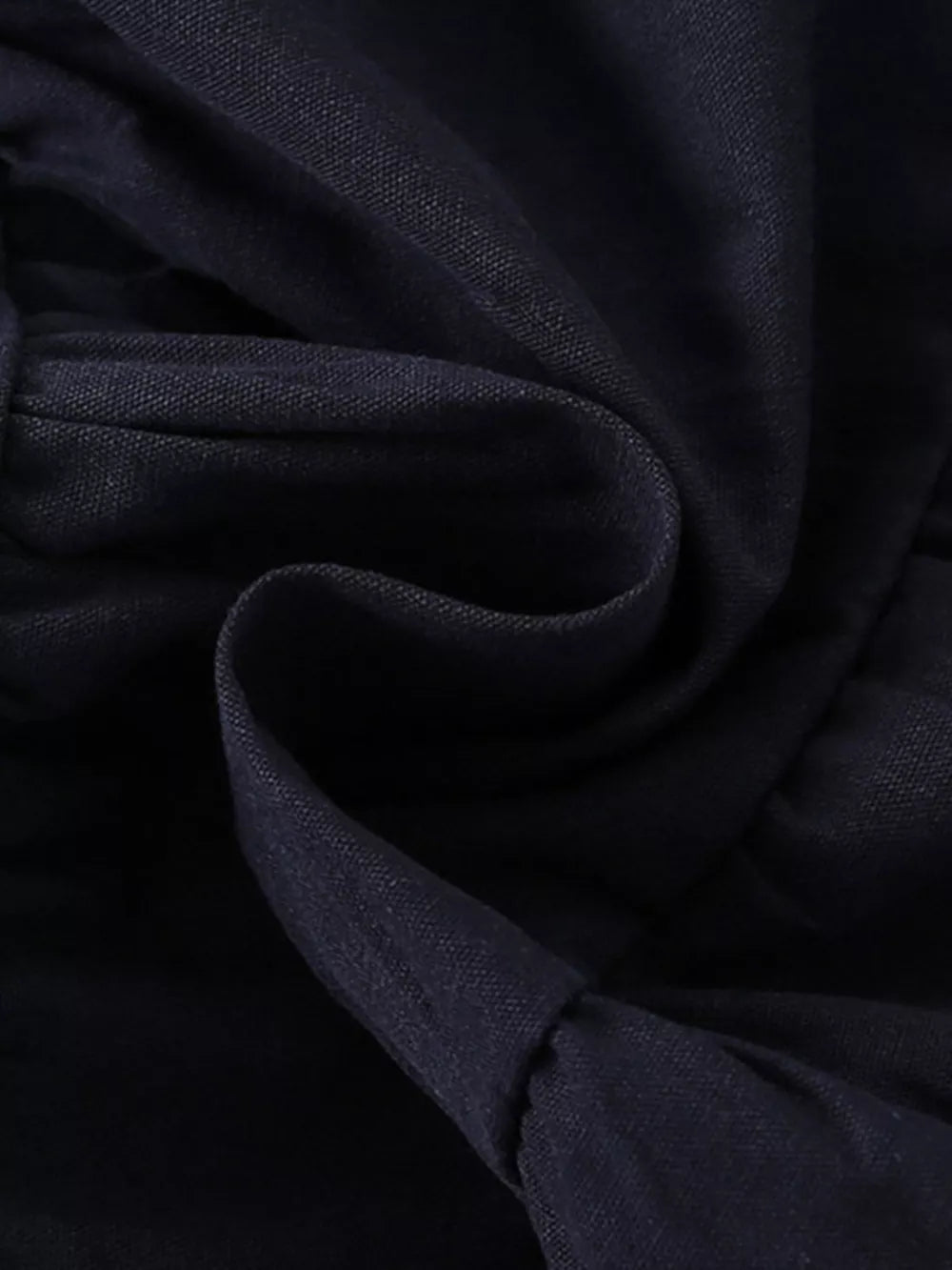 Dark navy cotton blend toddler dress with ruffled detail and button front texture.