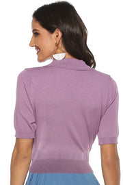Button-down knit polo top in lilac with short sleeves and a ribbed hem.
