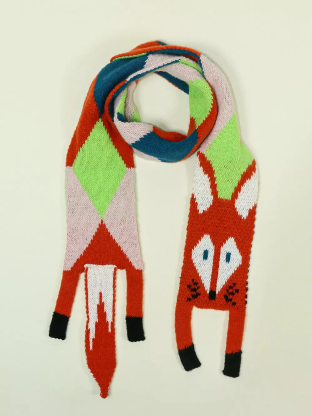 Chunky knit scarf with a playful fox design and geometric pattern in red, pink, green, and blue.