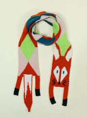 Chunky knit scarf with a playful fox design and geometric pattern in red, pink, green, and blue.